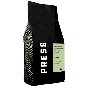 Black coffee bag with 'PRESS' branding and text on a white background